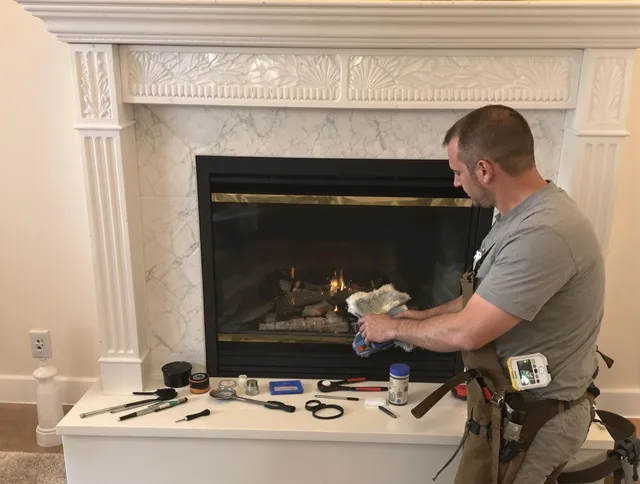 West Warwick Chimney Sweep performing fireplace maintenance in West Warwick, RI